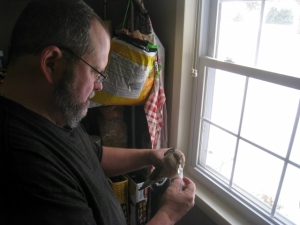 My husband tending to the pigeon